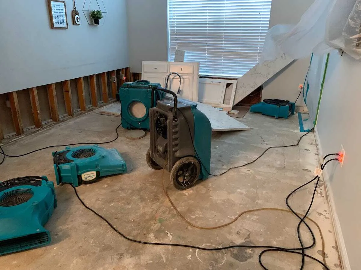 Dehumidifier in flood-cut room for Water Damage Restoration in Matthews